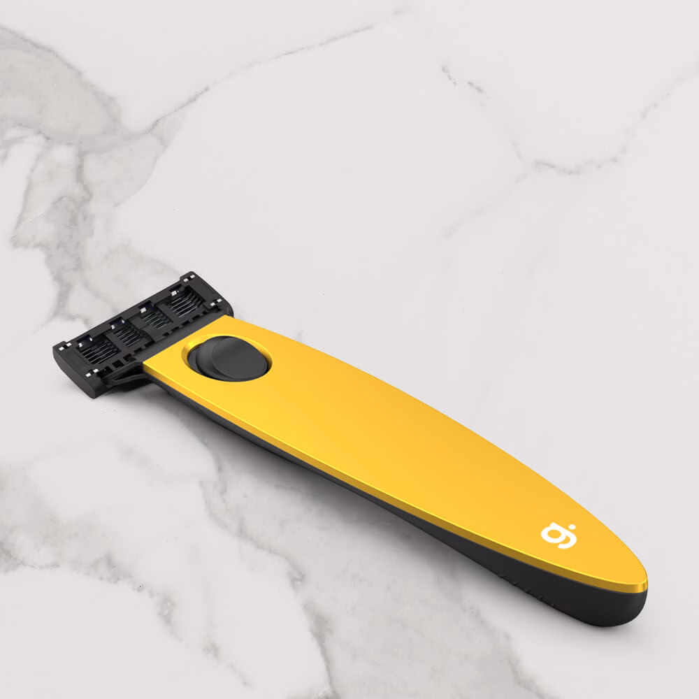 Yellow razor on marble surface.