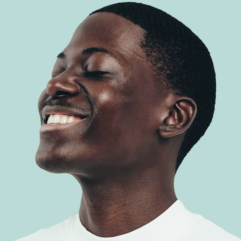 Person smiling with closed eyes