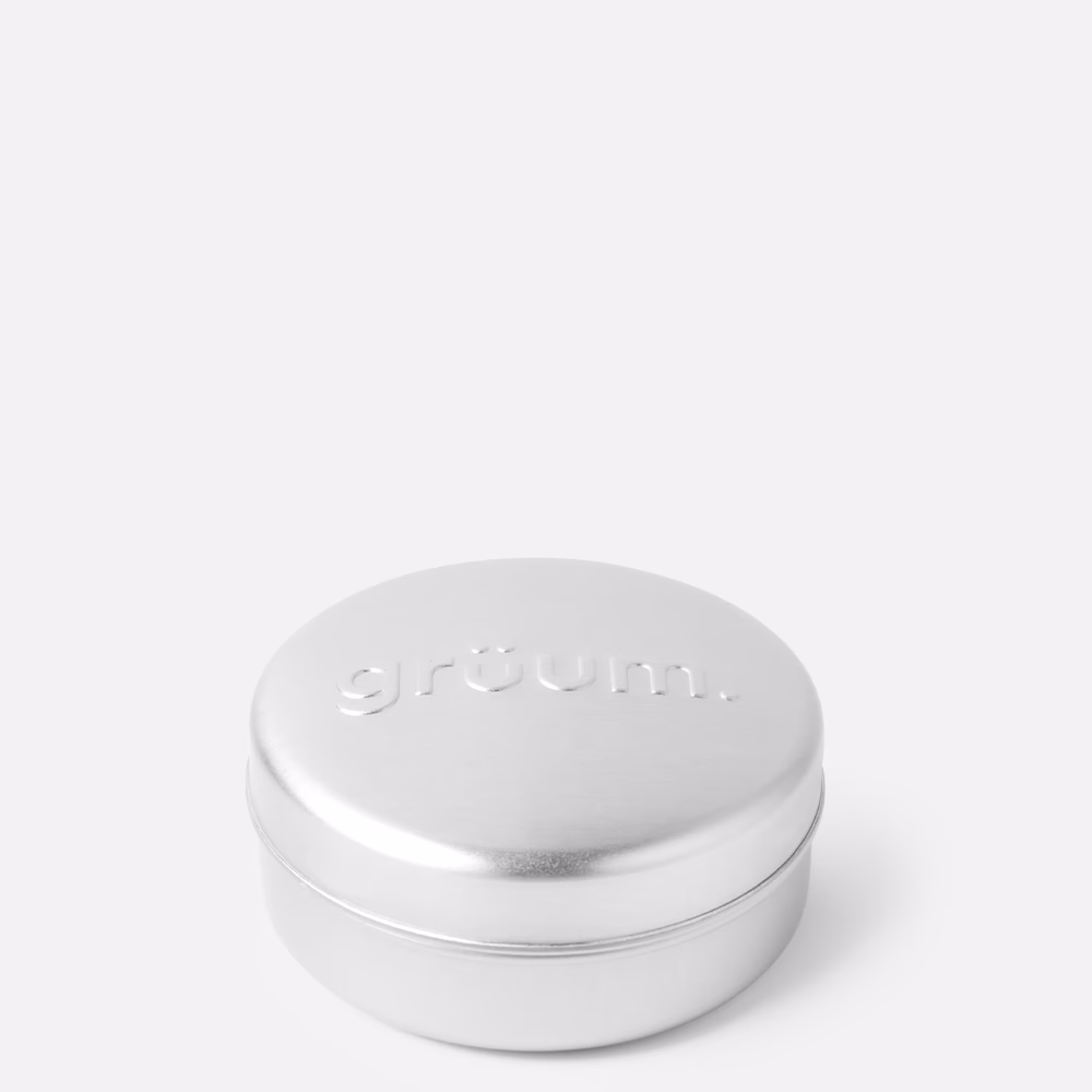 Silver metal tin with embossed logo