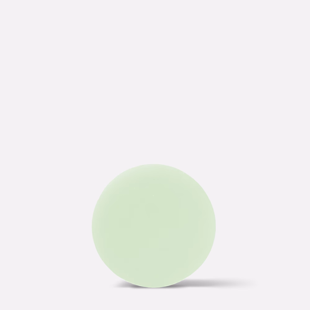 Pale green round soap bar