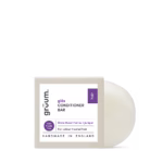 Handmade conditioner bar with white label and purple accents