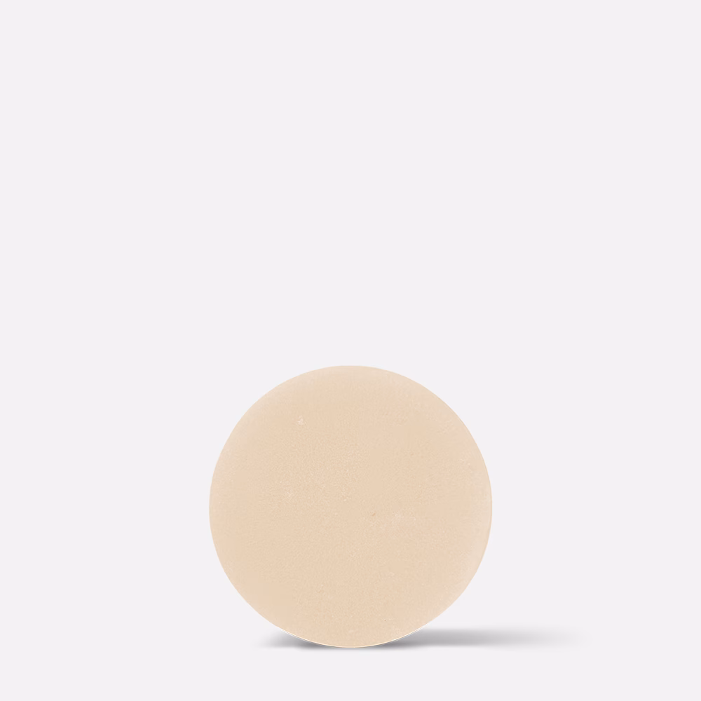 Beige round object on white background.