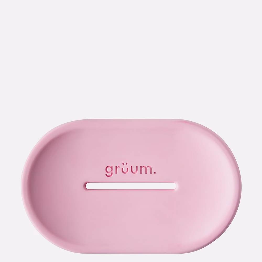 Pink oval soap dish with logo