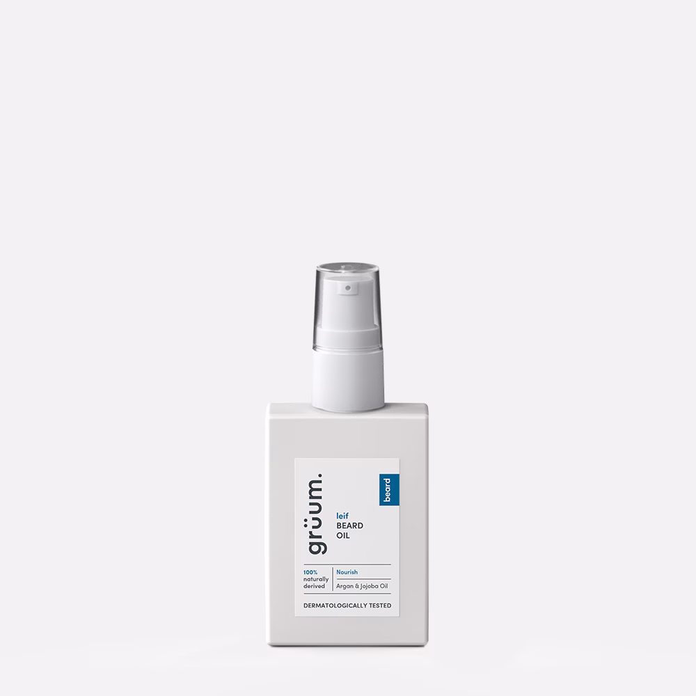White beard oil bottle on gray background.