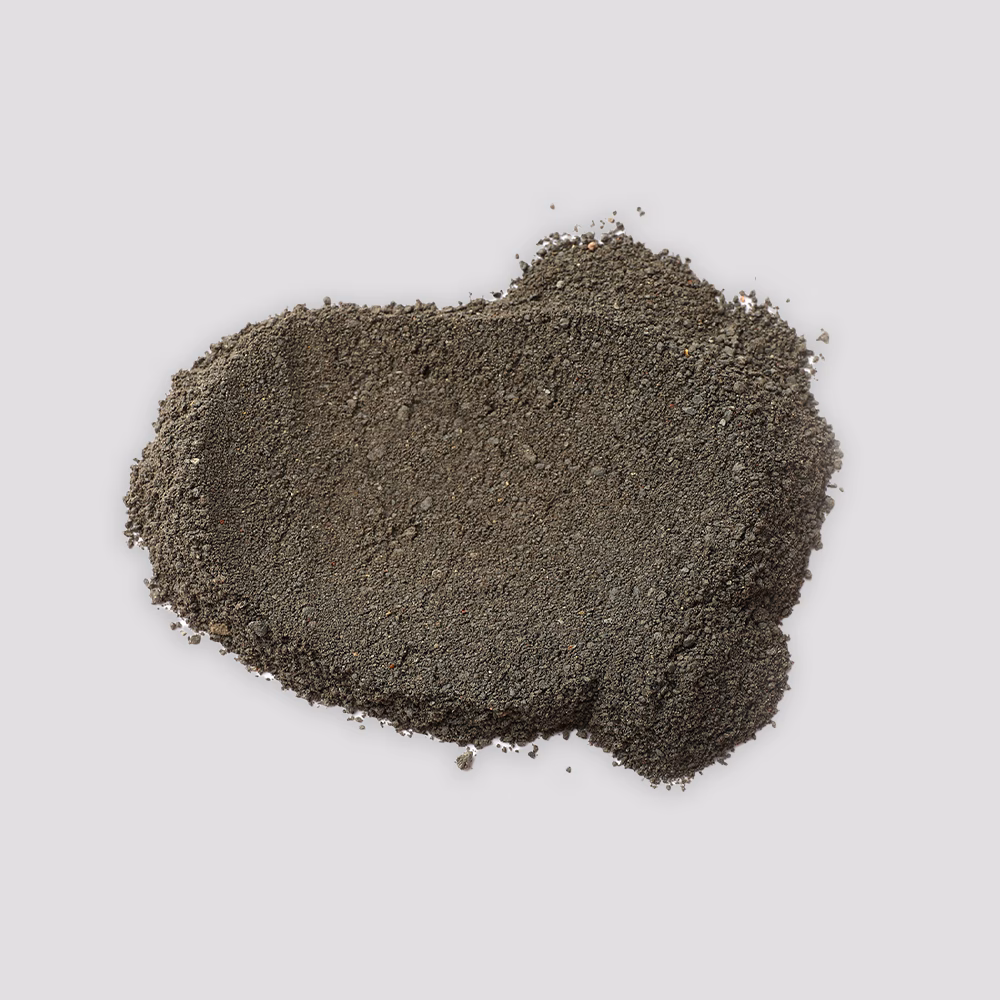 Pile of dark sand on background.