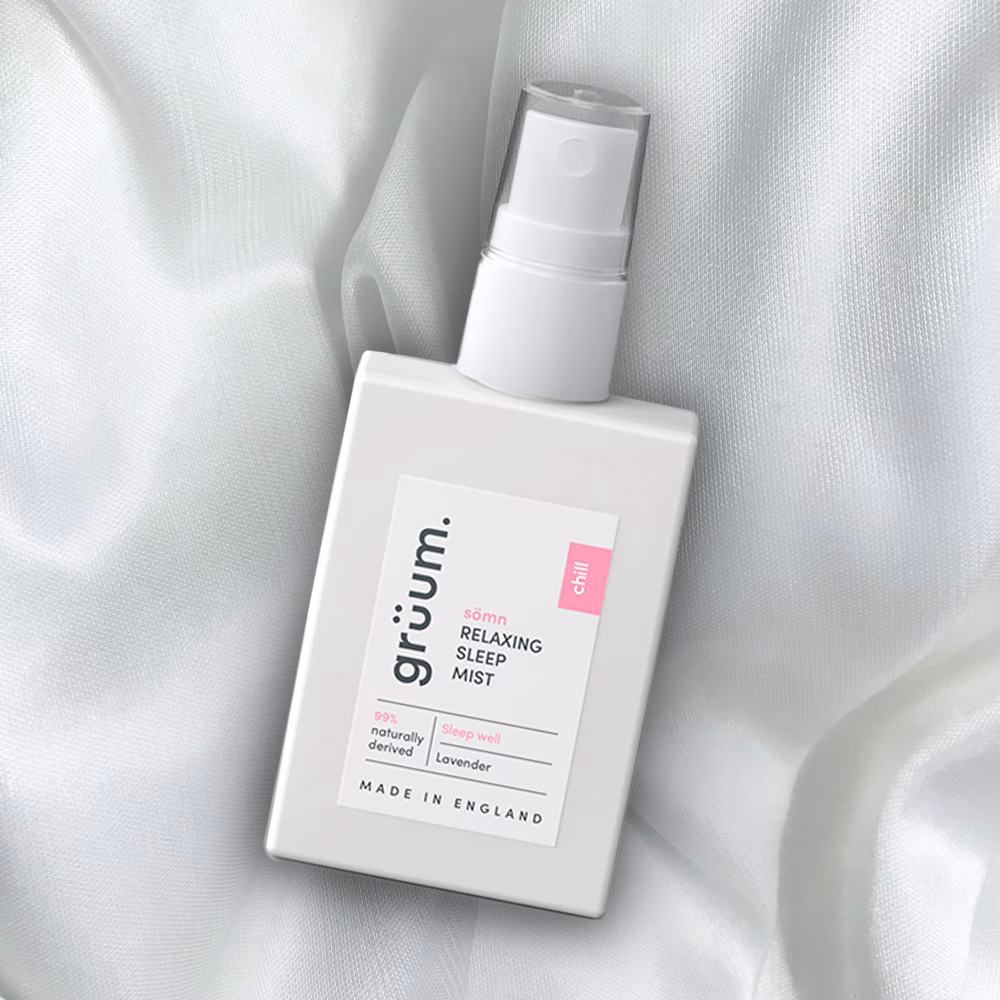 Relaxing sleep mist bottle on fabric