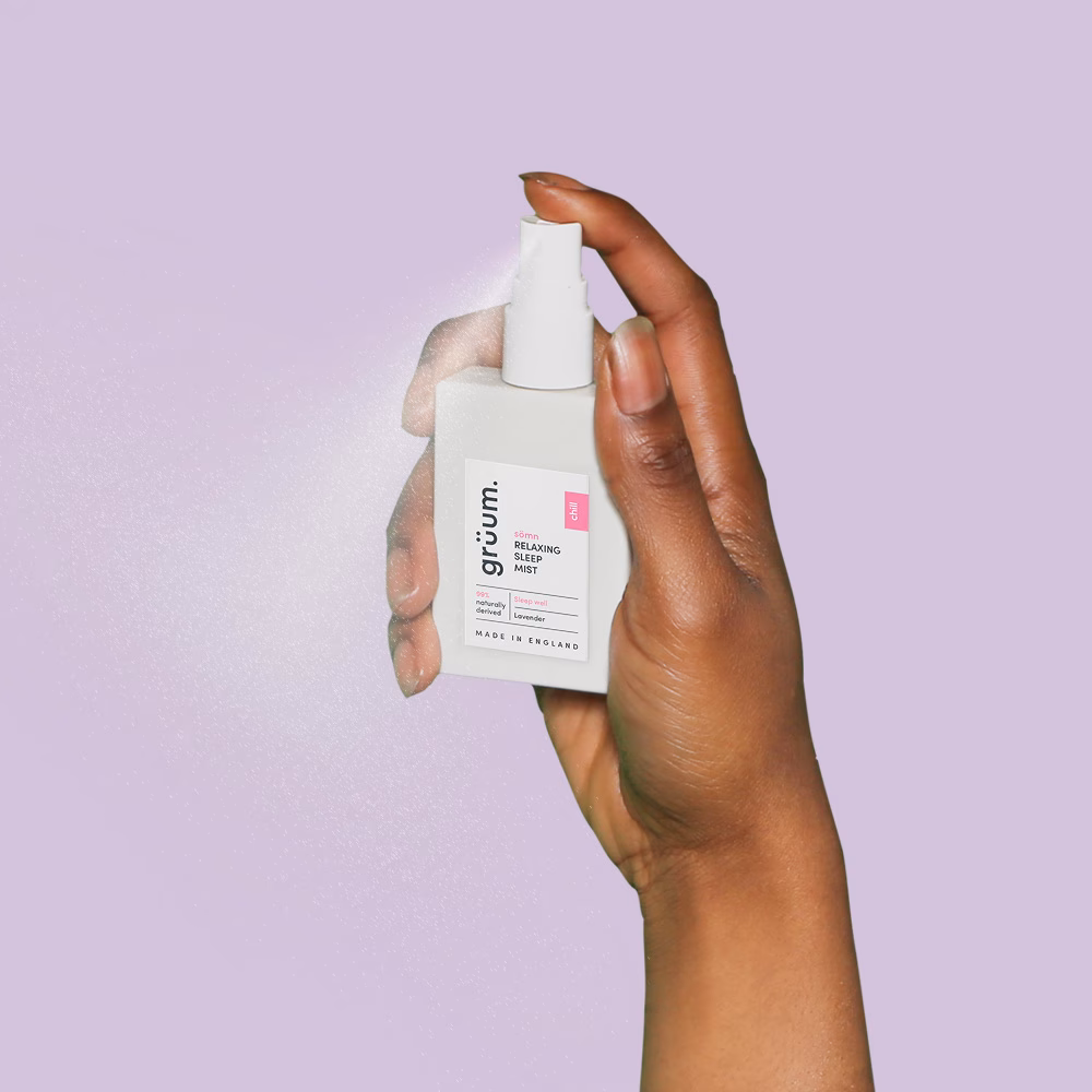 Hand holding sleep mist spray