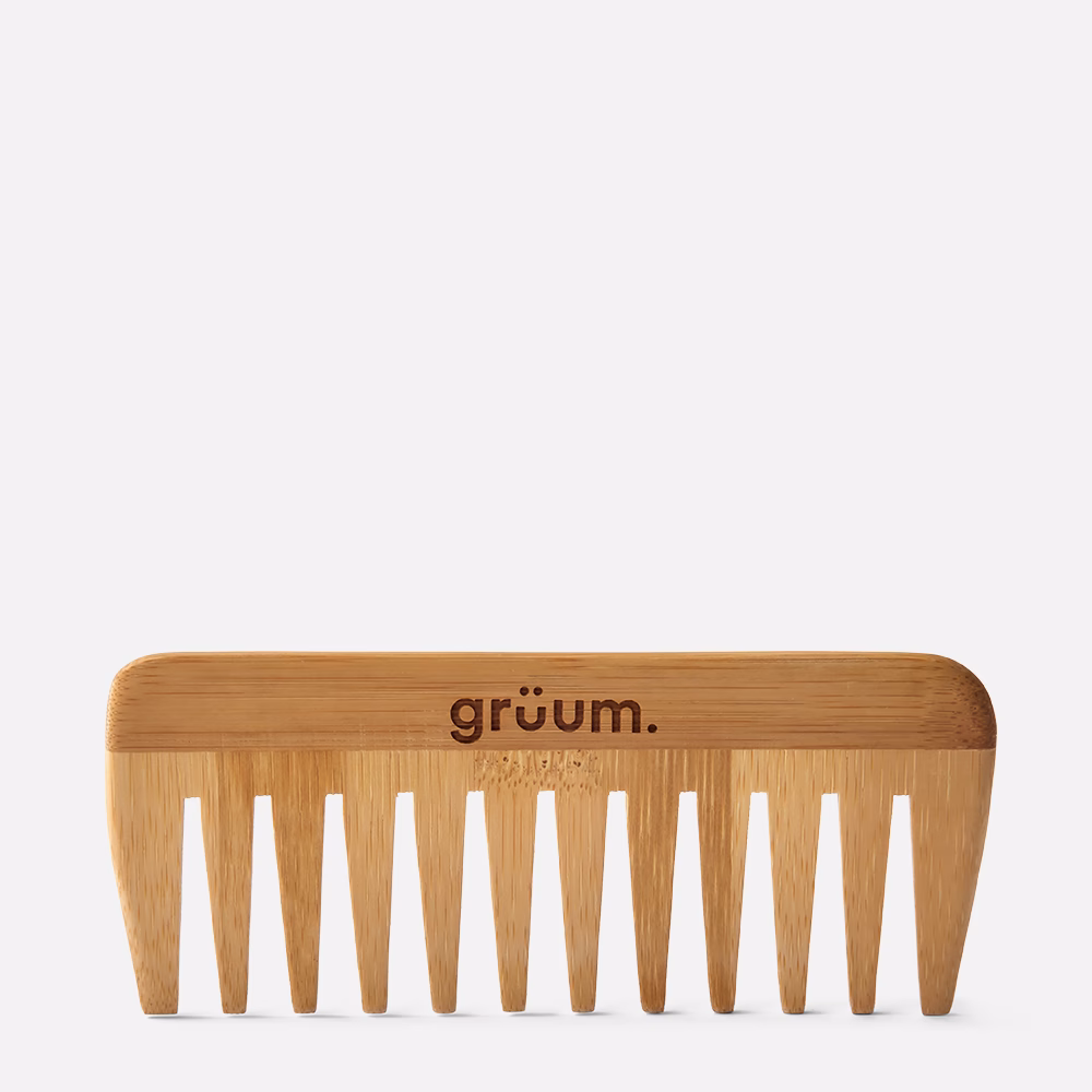 Bamboo comb on white background.