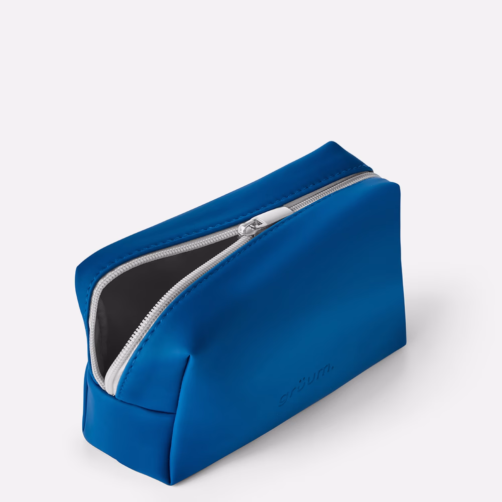 Blue rectangular toiletry bag with zipper.