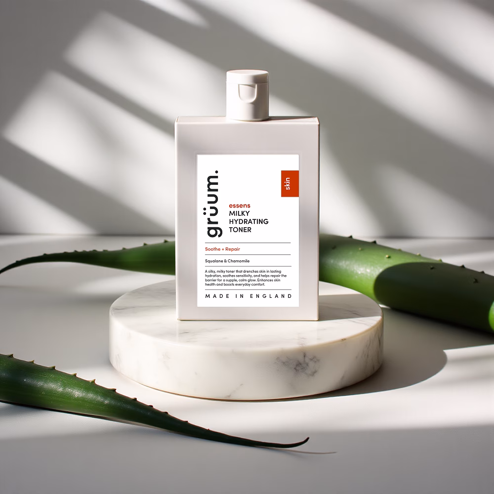 Bottle of hydrating toner on marble stand.