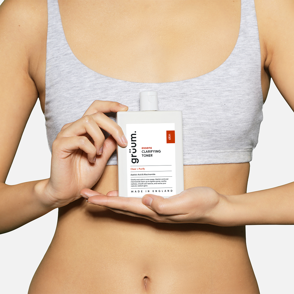 Person holding a clarifying toner bottle.