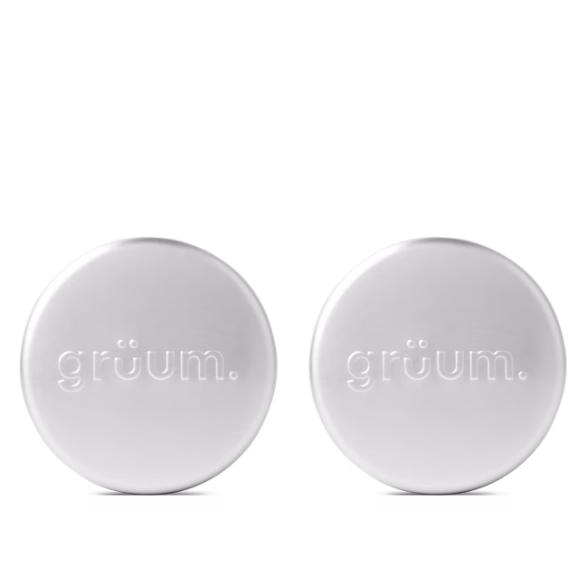 Two metal tins with gruum logo