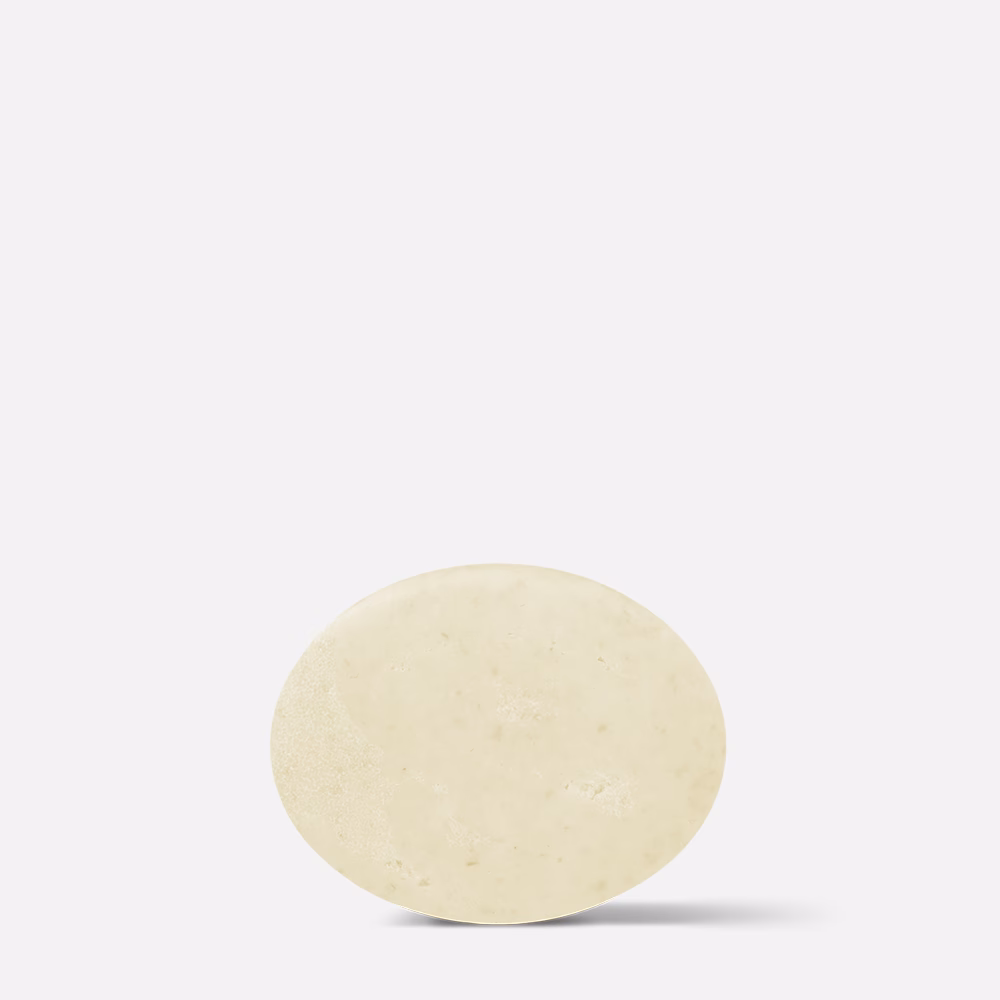 Round soap bar on white background.