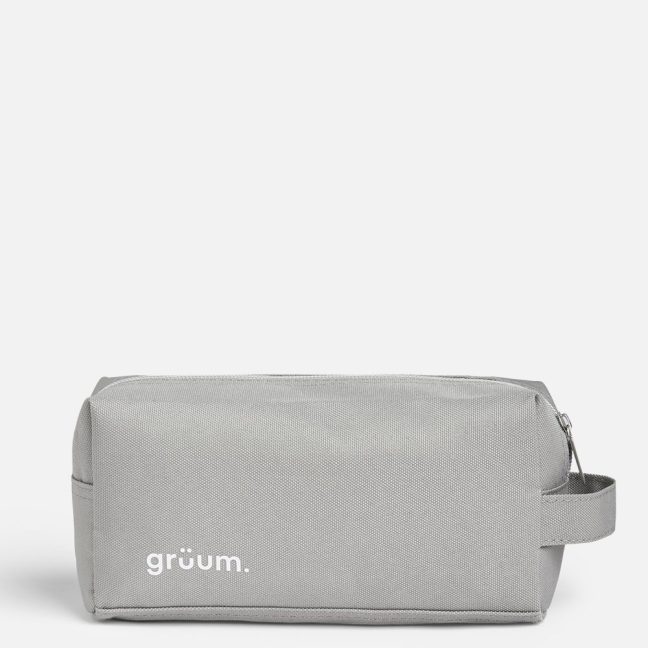 Gray toiletry bag with handle.