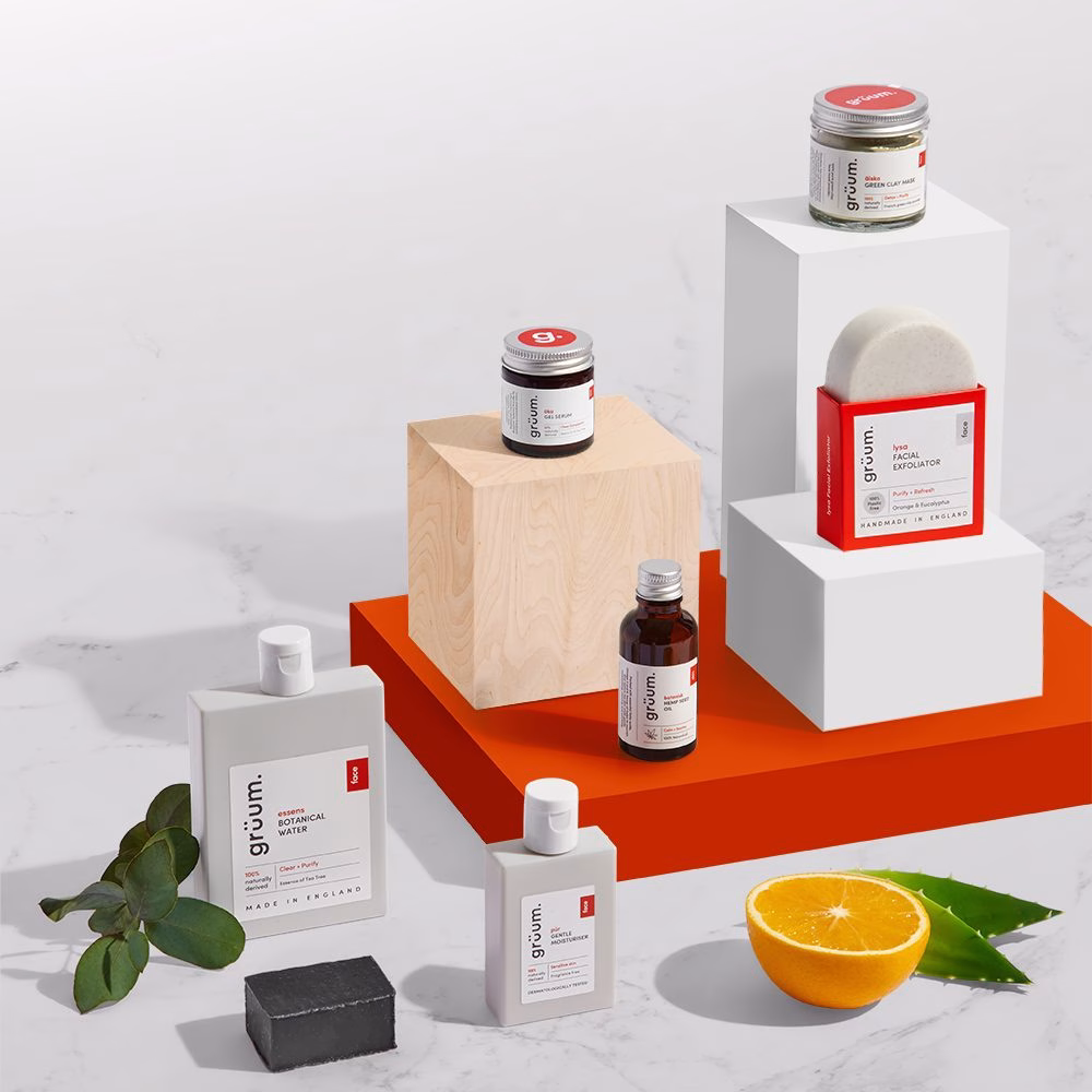 Skincare products and orange on blocks