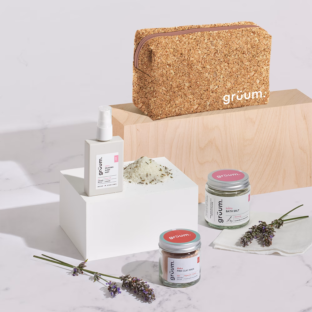 Cosmetic products with cork pouch and lavender.