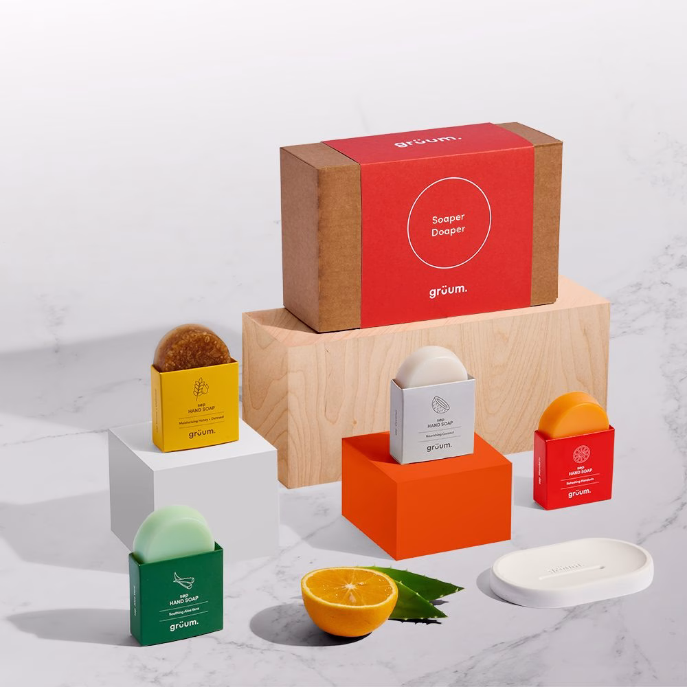 Various soaps and packaging displayed on blocks.