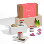 Clay mask products display with petals.