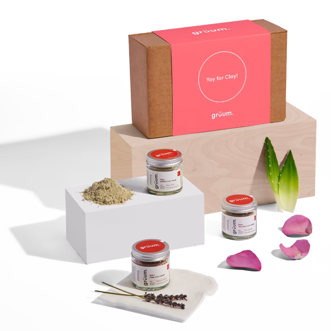 Clay mask products display with petals.