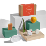 Natural skincare products display with aloe and orange.
