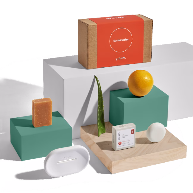 Natural skincare products display with aloe and orange.