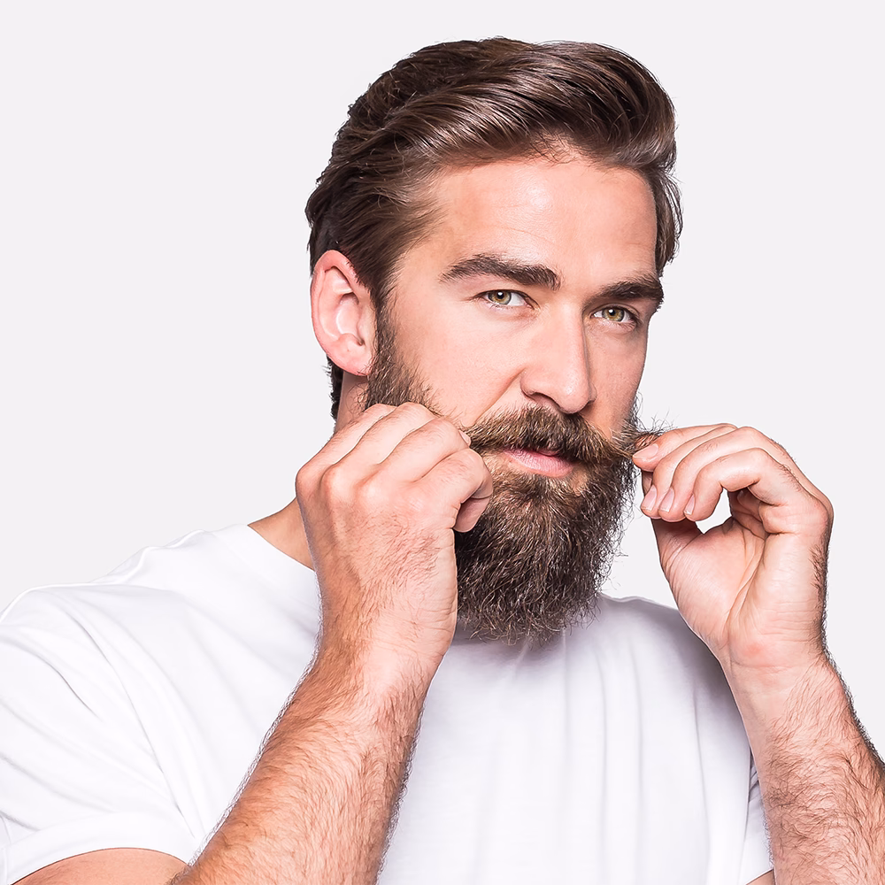Man adjusting his mustache