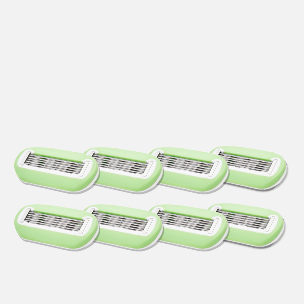 Eight green razor blade refills