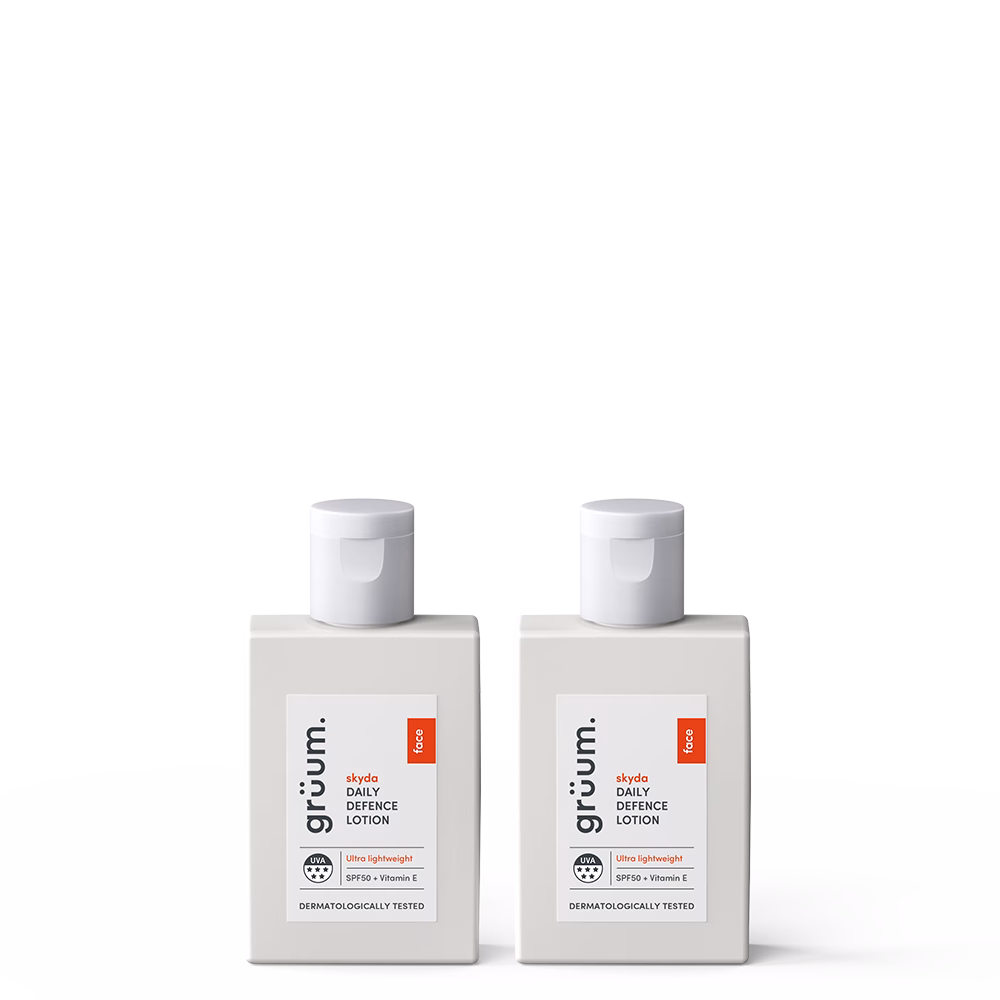 Two bottles of skincare lotion