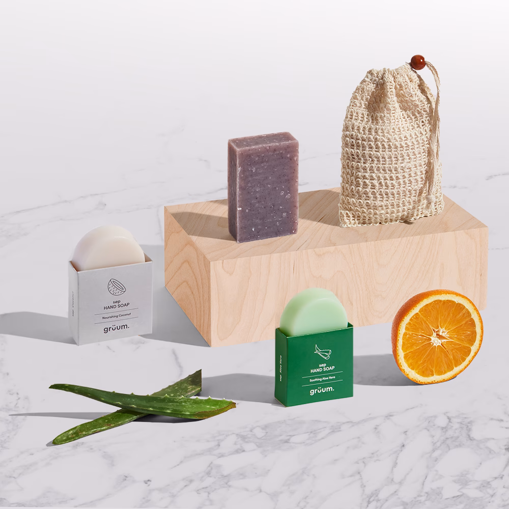 Natural soaps and orange slice on display.