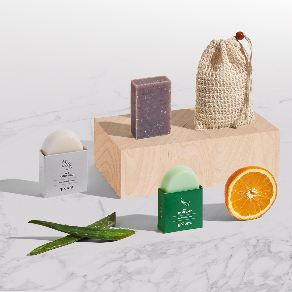 Natural soaps and orange slice on display.