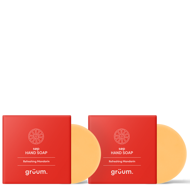 Two orange soaps with red packaging.