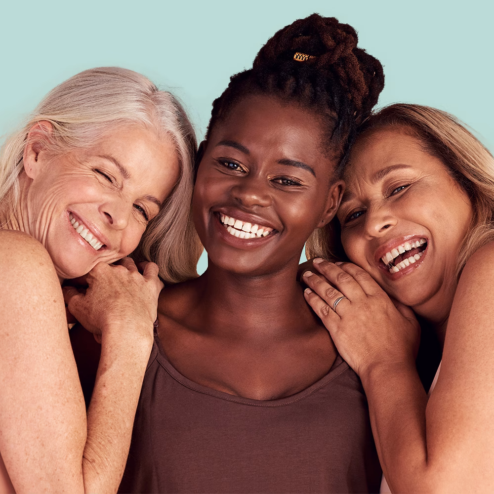 Three women smiling together