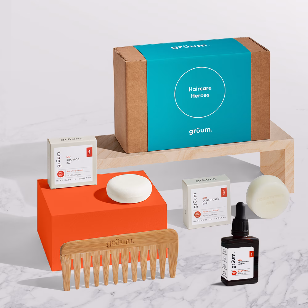 Haircare products display with comb and bottles.
