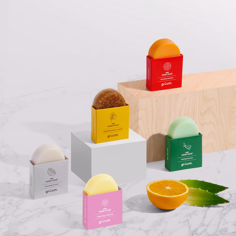 Colorful soap bars on white surface.