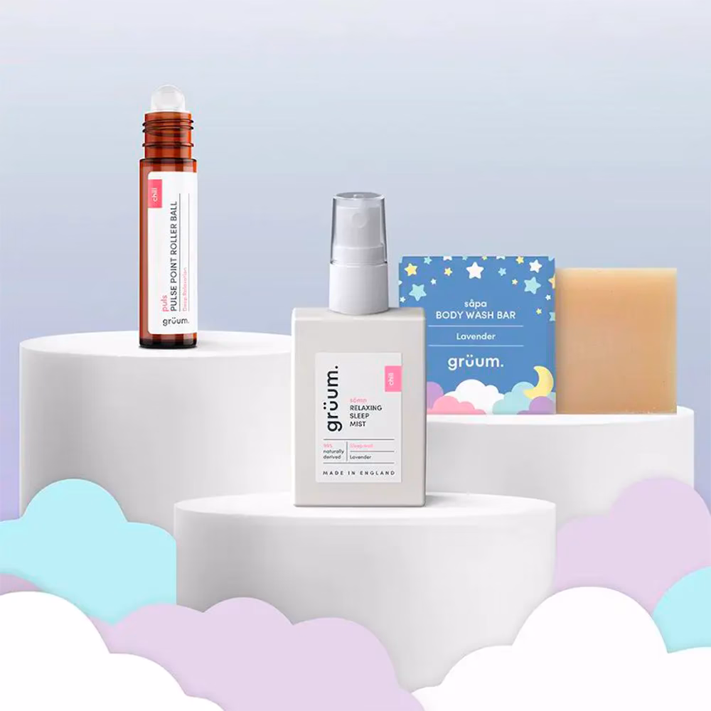 Skincare products on podiums with clouds.