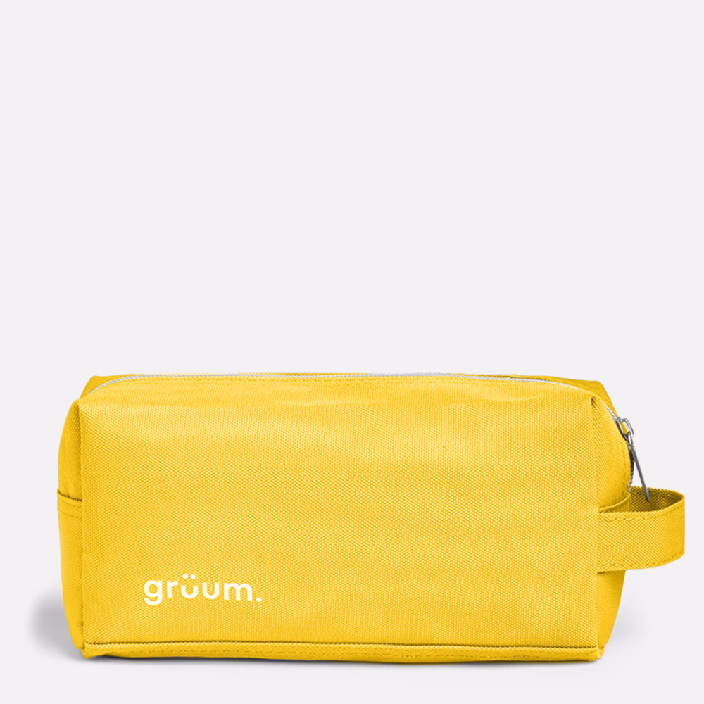 Yellow toiletry bag with handle.