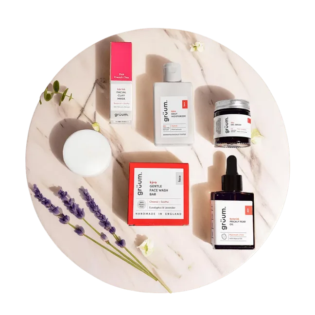 Skincare products arranged with lavender sprigs.