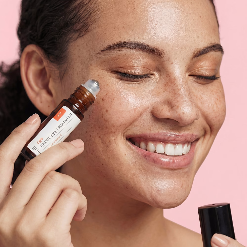 Woman applying under-eye treatment