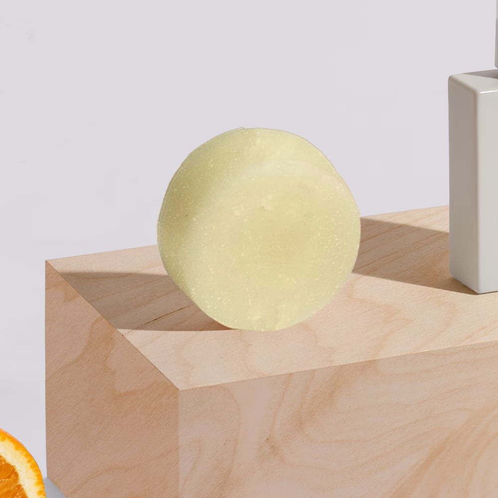 Round soap on wooden block