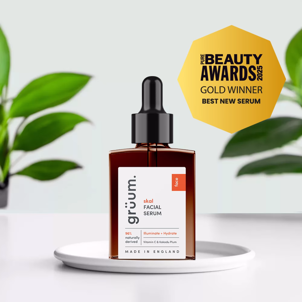 Facial serum bottle with award badge.