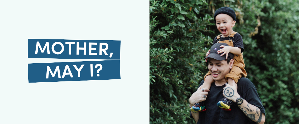 Child on adult's shoulders, smiling.