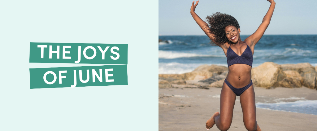 Woman jumping on beach with waves.