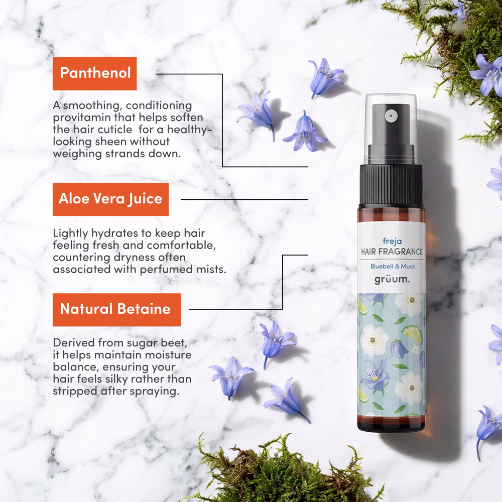 Bottle with blue flowers and moss