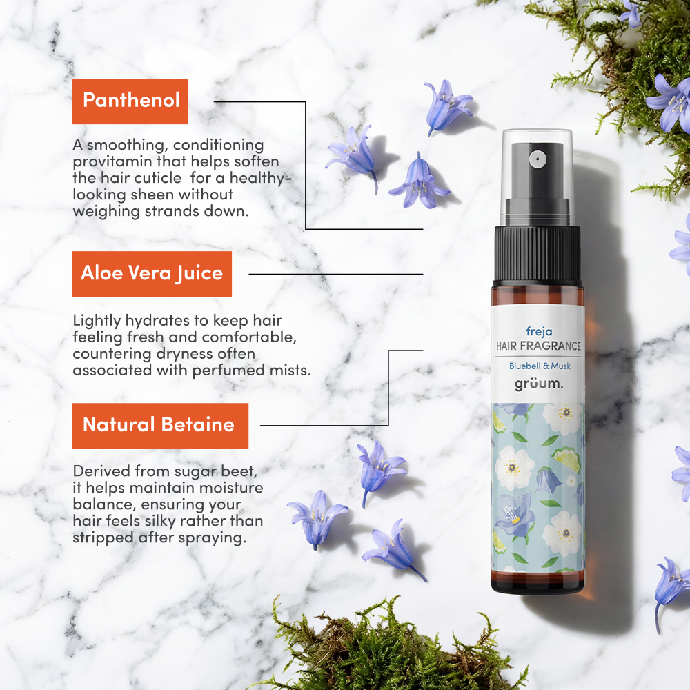 Bottle with blue flowers and moss