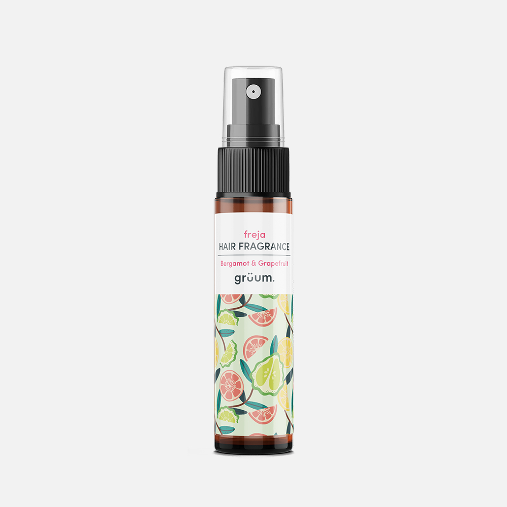 Hair fragrance spray bottle with fruit design.