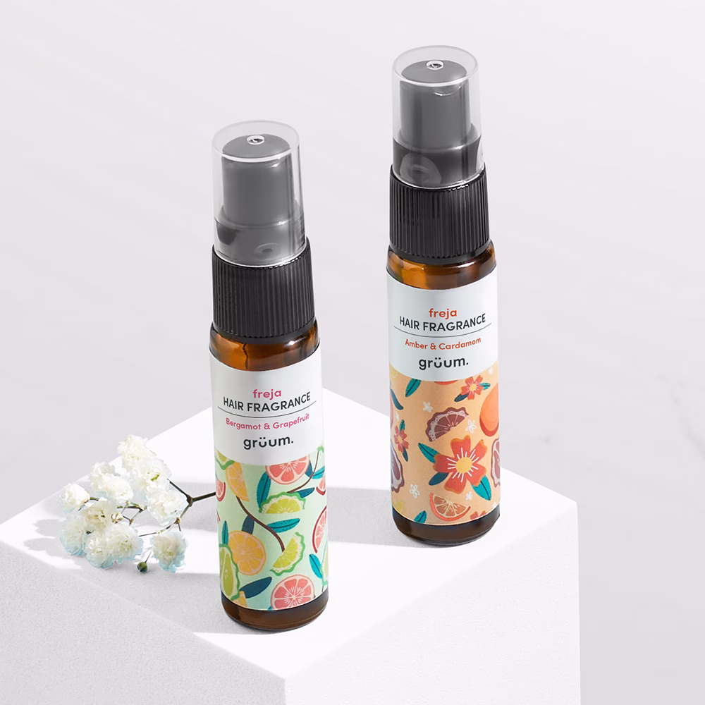 Two hair fragrance bottles on display.