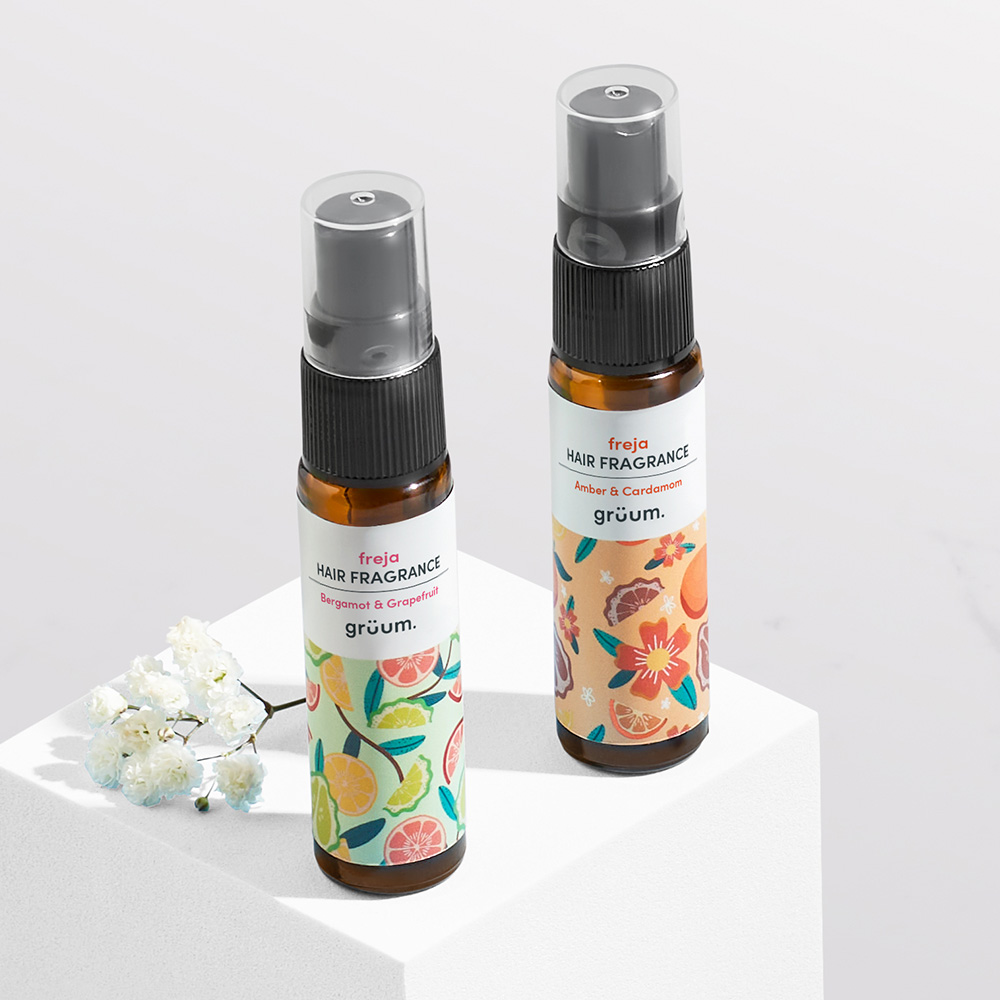 Two hair fragrance bottles on display.