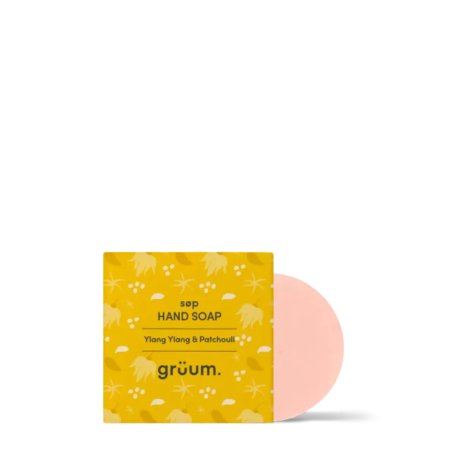 Yellow soap packaging with pink soap bar