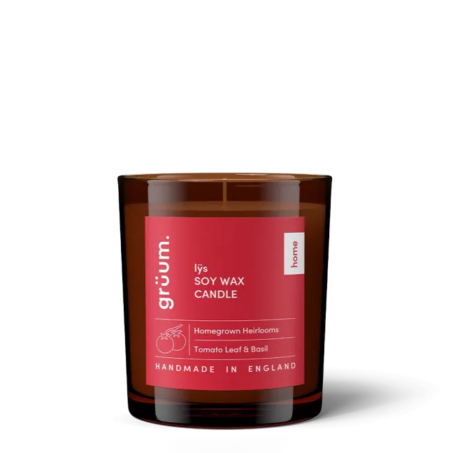 Brown wax candle in glass jar