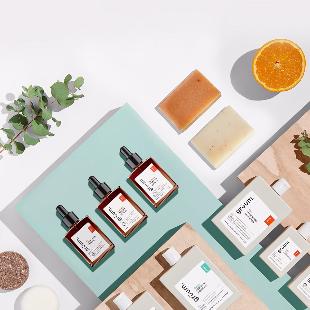 Skincare products and orange slice.